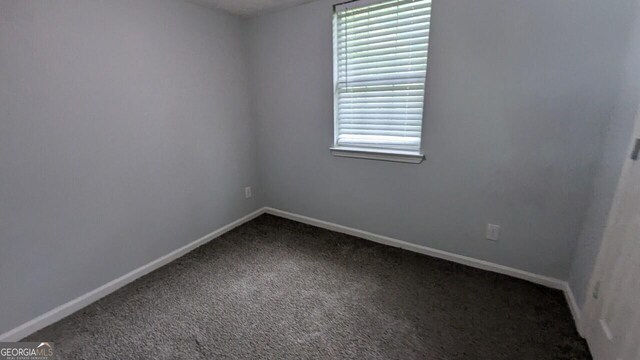 5710 Cardigan Trce, Sugar Hill, GA 30518 - unfurnished room with carpet flooring and baseboards