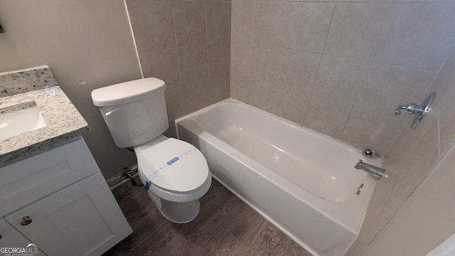 5710 Cardigan Trce, Sugar Hill, GA 30518 - bathroom featuring toilet, vanity, wood finished floors, and shower / washtub combination