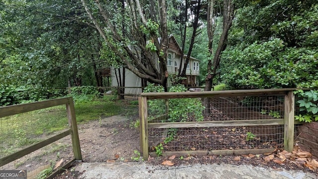 5710 Cardigan Trce, Sugar Hill, GA 30518 - gate featuring a garden