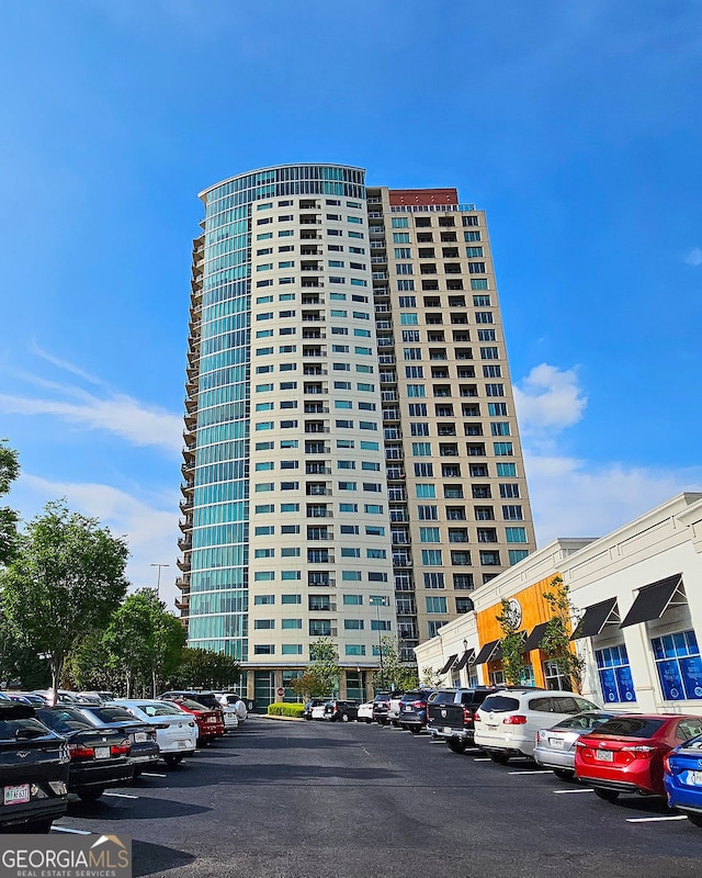 4561 Olde Perimeter Way Unit 608, Dunwoody, GA 30346 - view of property featuring uncovered parking