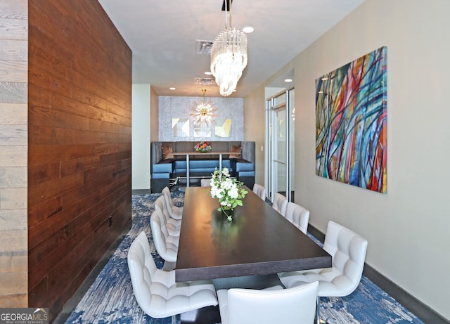 4561 Olde Perimeter Way Unit 608, Dunwoody, GA 30346 - dining room featuring a chandelier and wood walls