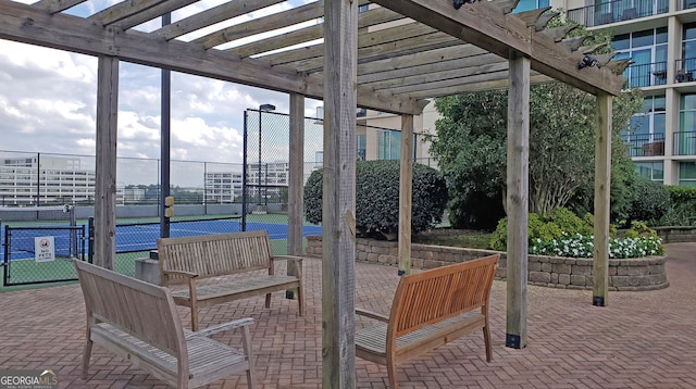 4561 Olde Perimeter Way Unit 608, Dunwoody, GA 30346 - view of patio / terrace featuring a pergola and a tennis court