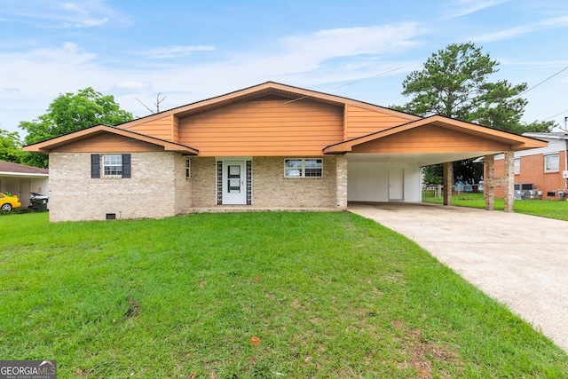 202 Kimberly Rd, Warner Robins, GA 31088 - view of front of house with brick siding, a front lawn, concrete driveway, and a carport