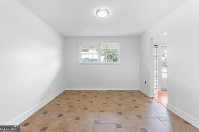 202 Kimberly Rd, Warner Robins, GA 31088 - empty room with baseboards and stone finish floors
