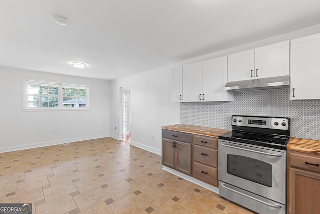 202 Kimberly Rd, Warner Robins, GA 31088 - kitchen with electric range, under cabinet range hood, wood counters, decorative backsplash, and white cabinetry