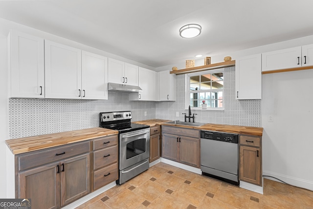 202 Kimberly Rd, Warner Robins, GA 31088 - kitchen with appliances with stainless steel finishes, wood counters, a sink, and under cabinet range hood