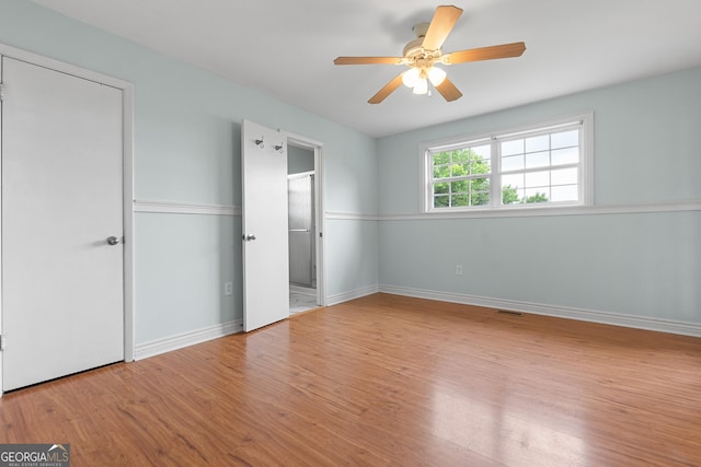 202 Kimberly Rd, Warner Robins, GA 31088 - unfurnished bedroom featuring wood finished floors, baseboards, and a ceiling fan