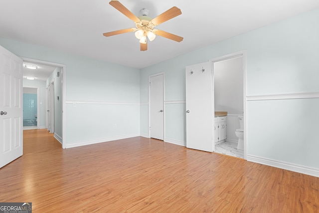 202 Kimberly Rd, Warner Robins, GA 31088 - unfurnished bedroom with light wood finished floors, connected bathroom, ceiling fan, and baseboards