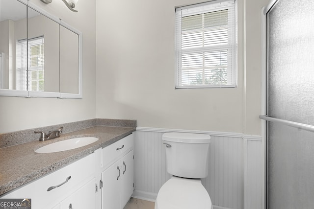 202 Kimberly Rd, Warner Robins, GA 31088 - full bath with a wainscoted wall, vanity, toilet, and a shower with door