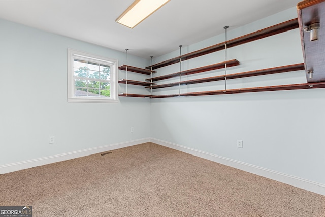 202 Kimberly Rd, Warner Robins, GA 31088 - carpeted spare room with baseboards