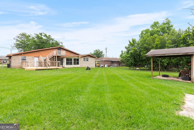 202 Kimberly Rd, Warner Robins, GA 31088 - view of grassy yard with stairway and a deck
