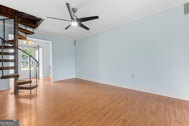 202 Kimberly Rd, Warner Robins, GA 31088 - unfurnished living room featuring wood finished floors, stairway, baseboards, crown molding, and ceiling fan