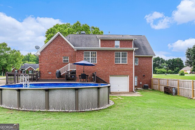 1112 Sutton Dr, Mcdonough, GA 30252 - rear view of property with brick siding, a garage, and a shingled roof
