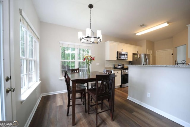 262 Devynwood Ln, Dallas, GA 30157 - dining space featuring a chandelier and dark wood-type flooring