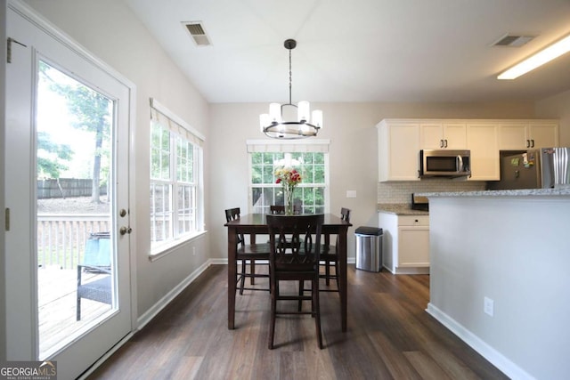 262 Devynwood Ln, Dallas, GA 30157 - dining room with a chandelier and dark wood finished floors