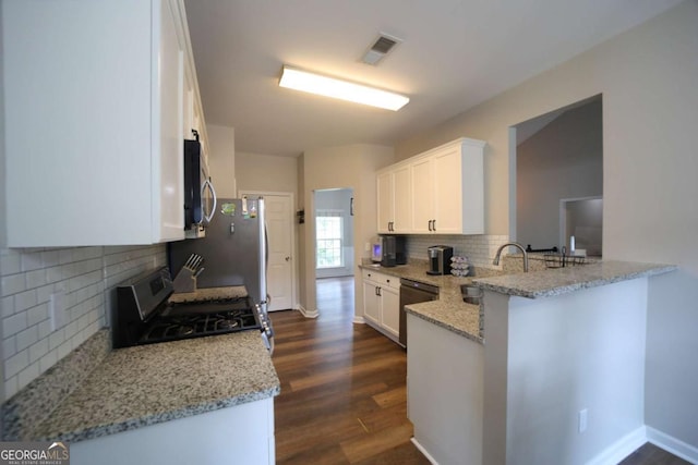 262 Devynwood Ln, Dallas, GA 30157 - kitchen featuring stainless steel appliances, dark wood-style floors, white cabinets, and decorative backsplash