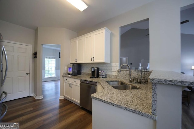 262 Devynwood Ln, Dallas, GA 30157 - kitchen with dishwasher, light stone counters, dark wood-style floors, a peninsula, and white cabinetry