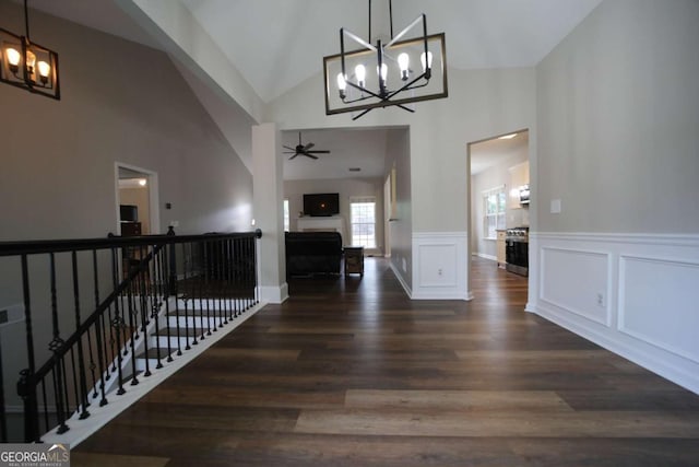 262 Devynwood Ln, Dallas, GA 30157 - hallway featuring a chandelier, wood finished floors, wainscoting, high vaulted ceiling, and an upstairs landing