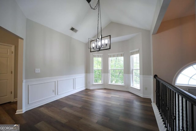 262 Devynwood Ln, Dallas, GA 30157 - unfurnished dining area with a wainscoted wall, a chandelier, healthy amount of natural light, dark wood-style floors, and high vaulted ceiling