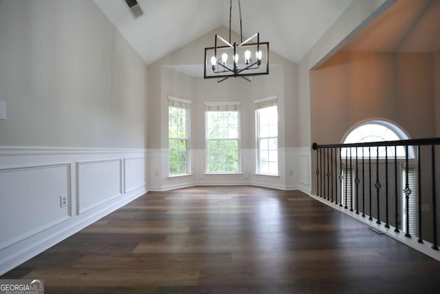 262 Devynwood Ln, Dallas, GA 30157 - empty room featuring a chandelier, a wainscoted wall, high vaulted ceiling, a decorative wall, and wood finished floors