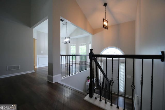 262 Devynwood Ln, Dallas, GA 30157 - stairs with a chandelier, wood finished floors, and high vaulted ceiling