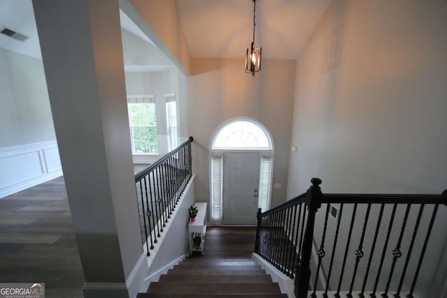 262 Devynwood Ln, Dallas, GA 30157 - entrance foyer with wood finished floors, a wainscoted wall, and a towering ceiling