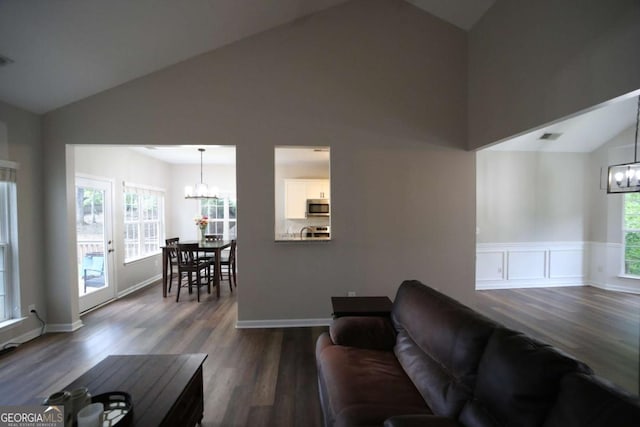 262 Devynwood Ln, Dallas, GA 30157 - living area featuring a chandelier, dark wood-style floors, and high vaulted ceiling