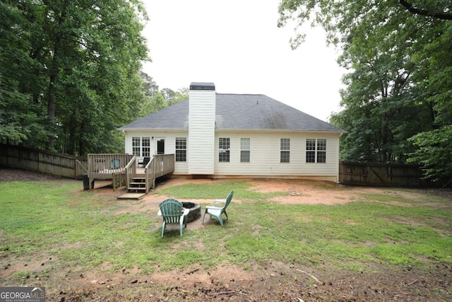 262 Devynwood Ln, Dallas, GA 30157 - rear view of house with a deck, a fenced backyard, a fire pit, and a chimney