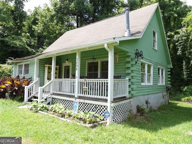 3096 Campground Rd, Winston, GA 30187 - view of front facade featuring a porch, log exterior, and a front yard