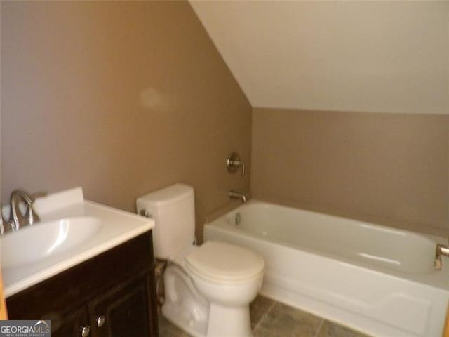 3096 Campground Rd, Winston, GA 30187 - full bath with a tub to relax in, vaulted ceiling, vanity, and tile patterned floors