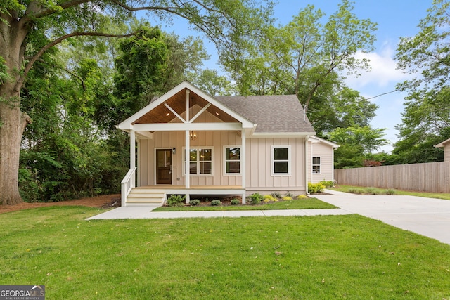 1036 Dell Ave SE, Smyrna, GA 30080 - view of front of home with board and batten siding, a porch, and a shingled roof