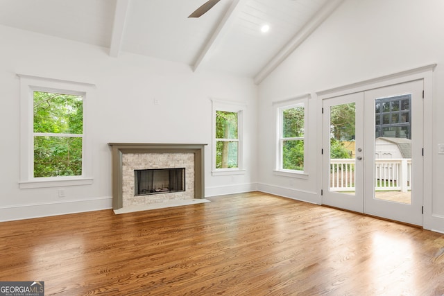 1036 Dell Ave SE, Smyrna, GA 30080 - unfurnished living room featuring french doors, plenty of natural light, and wood finished floors