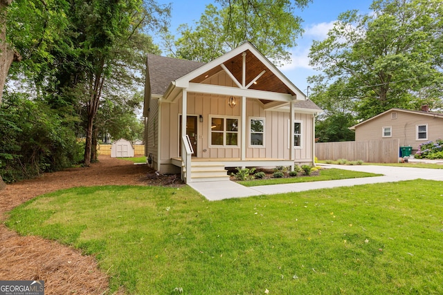 1036 Dell Ave SE, Smyrna, GA 30080 - view of front of house with board and batten siding, covered porch, and roof with shingles