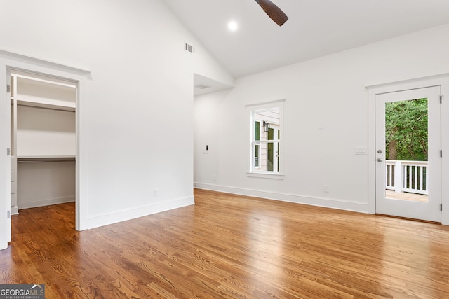 1036 Dell Ave SE, Smyrna, GA 30080 - empty room with a ceiling fan, light wood finished floors, baseboards, high vaulted ceiling, and recessed lighting