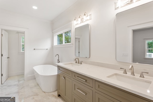 1036 Dell Ave SE, Smyrna, GA 30080 - full bathroom with double vanity, plenty of natural light, a soaking tub, marble finish floors, and recessed lighting