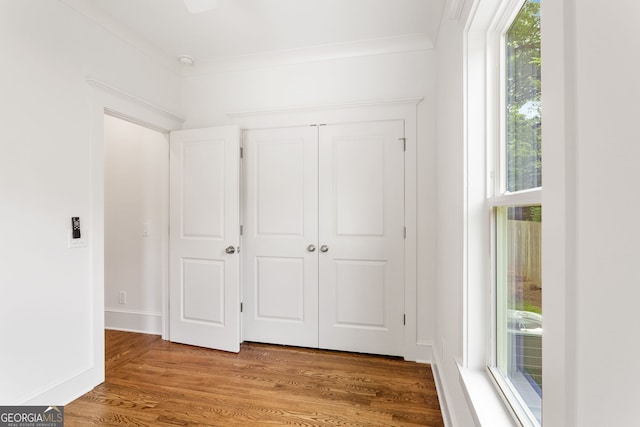 1036 Dell Ave SE, Smyrna, GA 30080 - unfurnished bedroom with wood finished floors, a closet, and ornamental molding