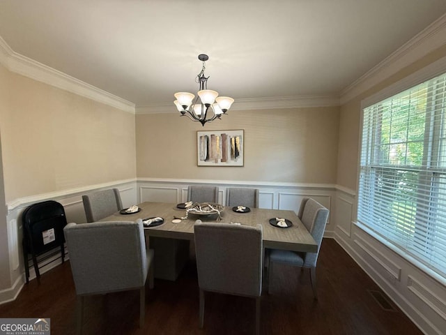 3020 Whitfield Ave, Cumming, GA 30040 - dining space featuring a chandelier, dark wood-style flooring, ornamental molding, wainscoting, and a decorative wall