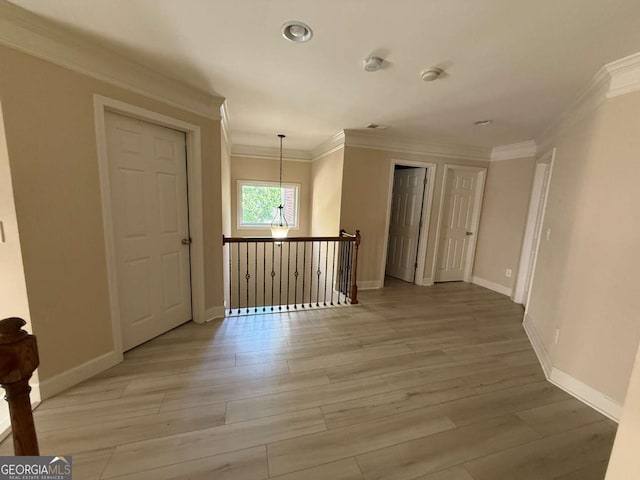 3020 Whitfield Ave, Cumming, GA 30040 - unfurnished room featuring crown molding, light wood-style floors, and a smoke detector