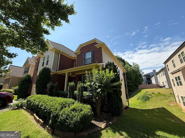 3020 Whitfield Ave, Cumming, GA 30040 - view of home's exterior featuring brick siding and a lawn