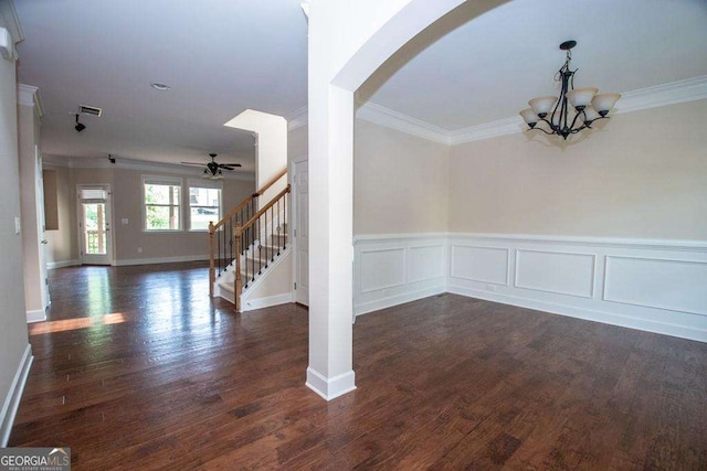 3020 Whitfield Ave, Cumming, GA 30040 - unfurnished dining area featuring ornamental molding, stairway, arched walkways, ceiling fan, and a chandelier
