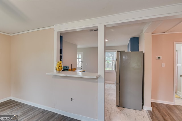 2325 Henry Cir, Augusta, GA 30906 - kitchen featuring freestanding refrigerator, baseboards, wood finished floors, and light countertops