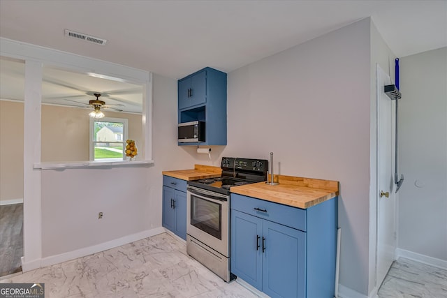 2325 Henry Cir, Augusta, GA 30906 - kitchen featuring butcher block counters, stainless steel appliances, blue cabinets, and light marble finish flooring