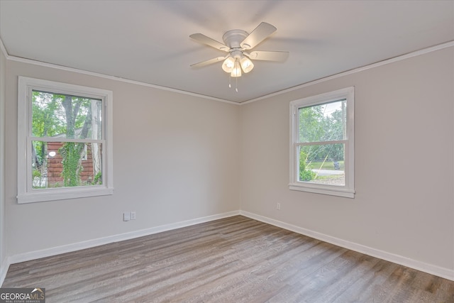 2325 Henry Cir, Augusta, GA 30906 - empty room featuring crown molding, baseboards, wood finished floors, and ceiling fan