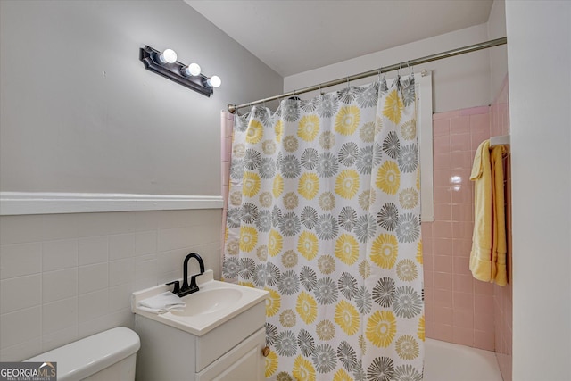 2325 Henry Cir, Augusta, GA 30906 - bathroom with vanity, toilet, tile walls, and shower / bath combo