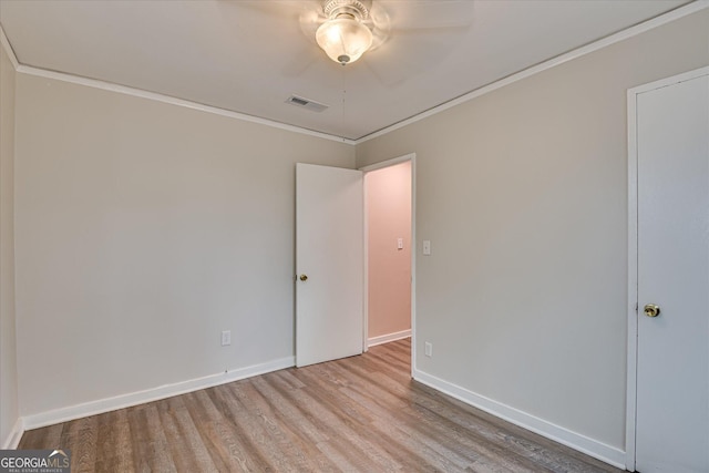 2325 Henry Cir, Augusta, GA 30906 - unfurnished room featuring wood finished floors, crown molding, baseboards, and a ceiling fan