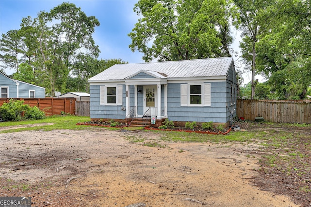 2325 Henry Cir, Augusta, GA 30906 - view of front facade with a fenced backyard and metal roof