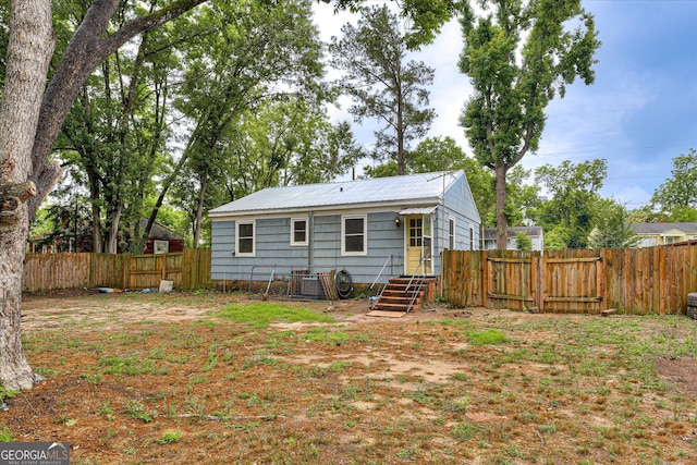 2325 Henry Cir, Augusta, GA 30906 - rear view of property featuring a fenced backyard and metal roof