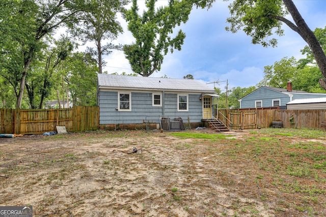 2325 Henry Cir, Augusta, GA 30906 - rear view of house featuring a fenced backyard and central AC
