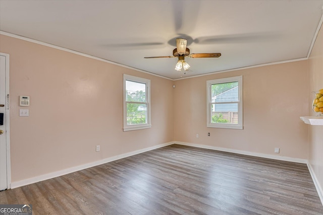 2325 Henry Cir, Augusta, GA 30906 - spare room featuring healthy amount of natural light, ornamental molding, wood finished floors, ceiling fan, and baseboards