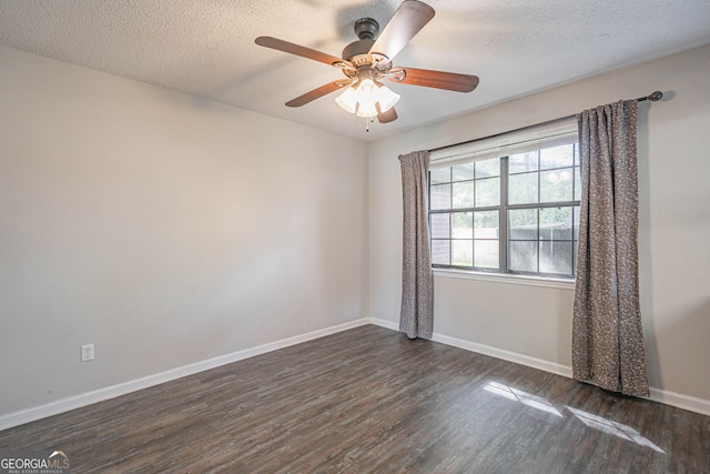 755 Madison Dr, Hinesville, GA 31313 - spare room with dark wood finished floors, baseboards, ceiling fan, and a textured ceiling